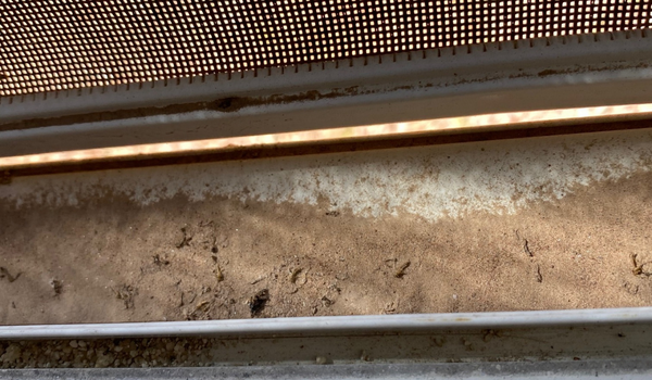 Smudged window prior to streak-free window washing in Arizona