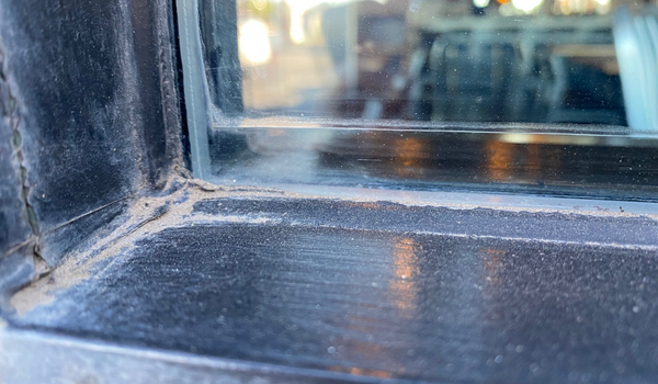 Exterior window buildup before deep glass cleaning in Scottsdale