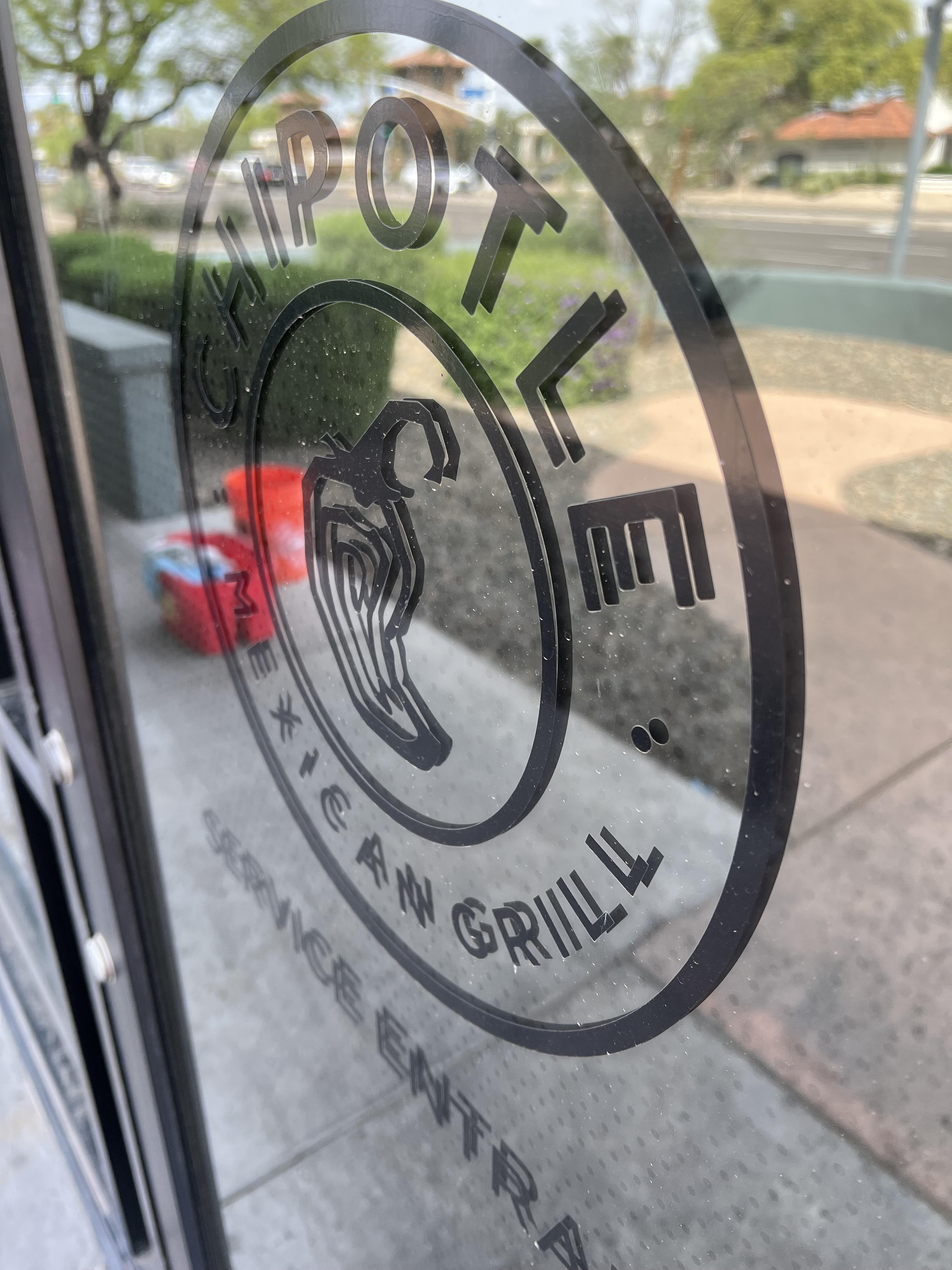 Dirty Chipotle window before cleaning